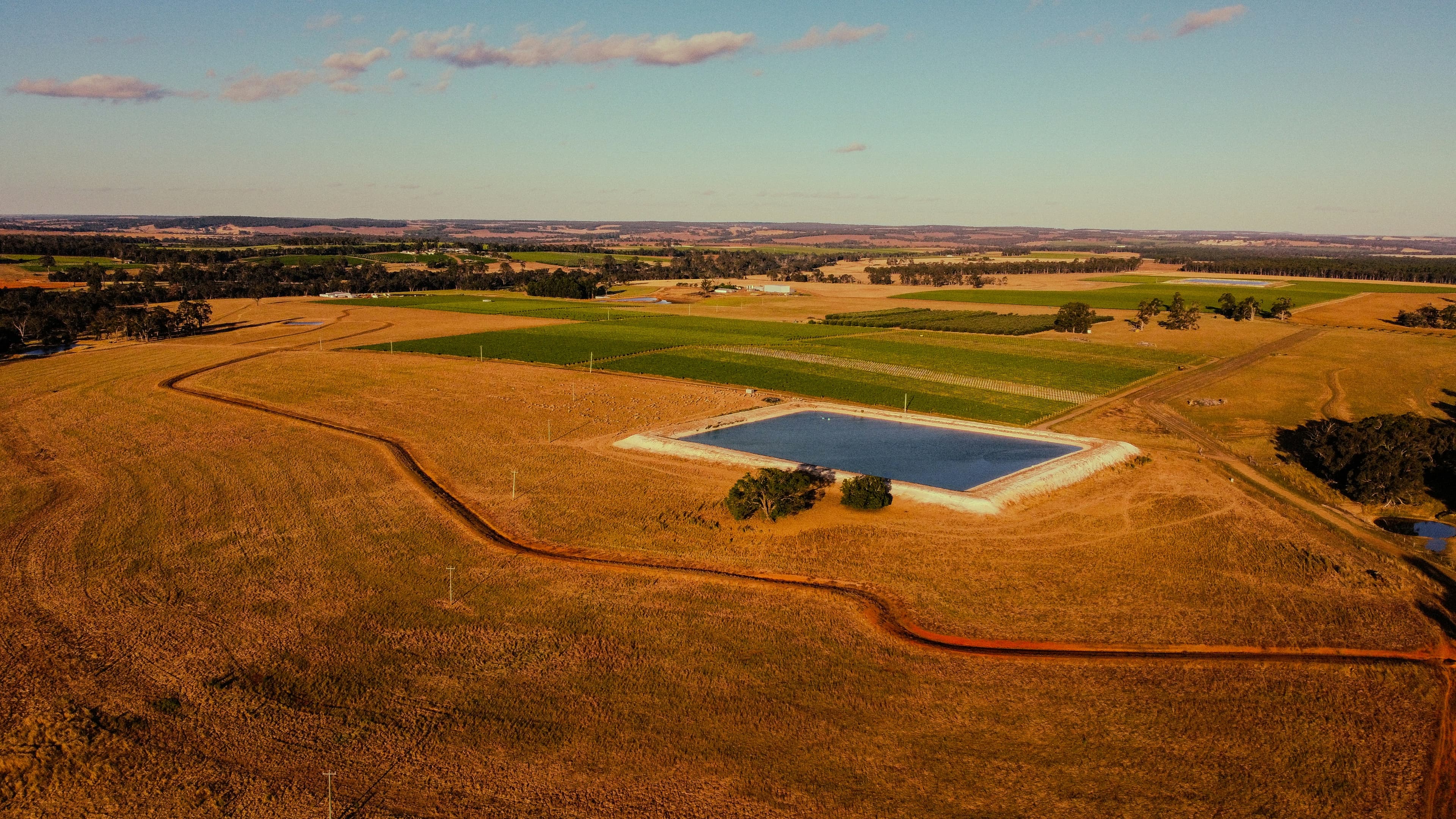 Aerial view of Australian farmland with a farm dam